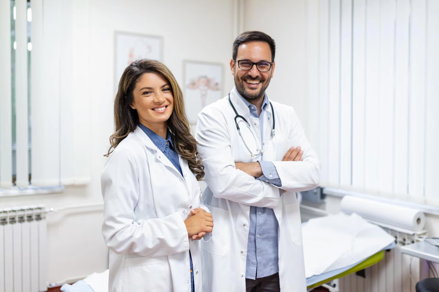 portrait-smiling-young-doctors-standing-together-portrait-medical-staff-inside-modern-hospital-smiling-camera_657921-885 (1)